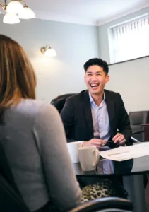 decorative image: Financial Planner, Jordan Wong, Client meeting