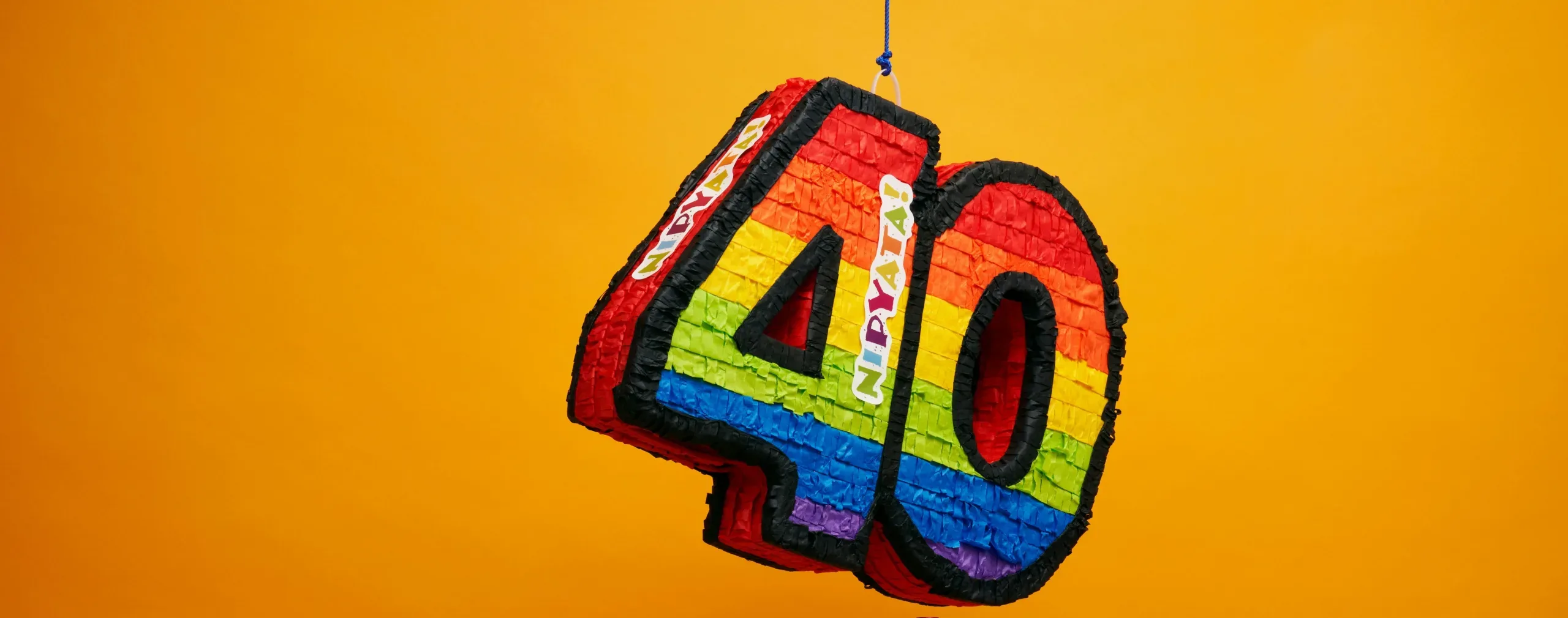 decorative image: a pinata in digits 40 hanging from the top, orange background,