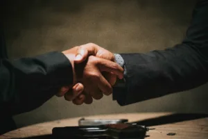 Decorative image of a handshake. To accompany blog on financial planning after selling a business
