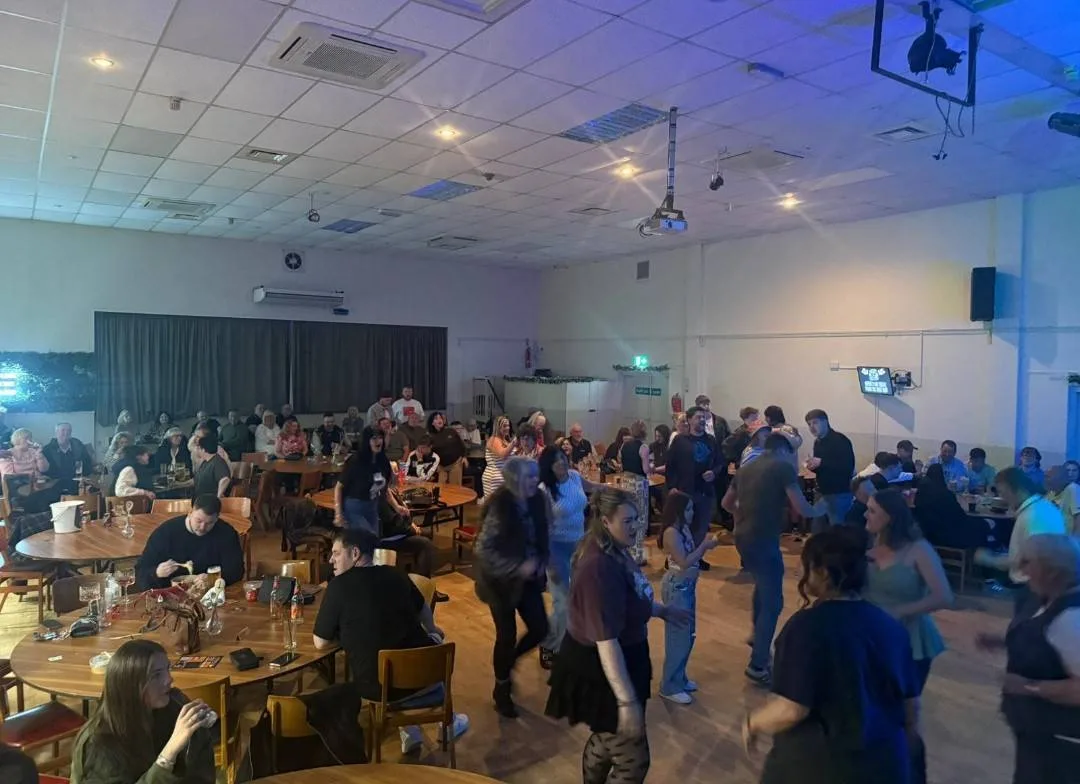 Rainworth Miners Trust - image of an event with lots of people in the hall area.