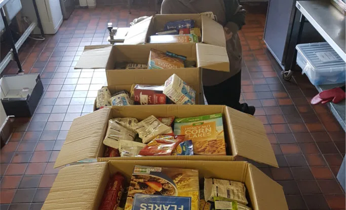 Image of food packed in boxes to accompany a blog on the Chesterton House Foundation grant to Chroma Foodbank in Leicester